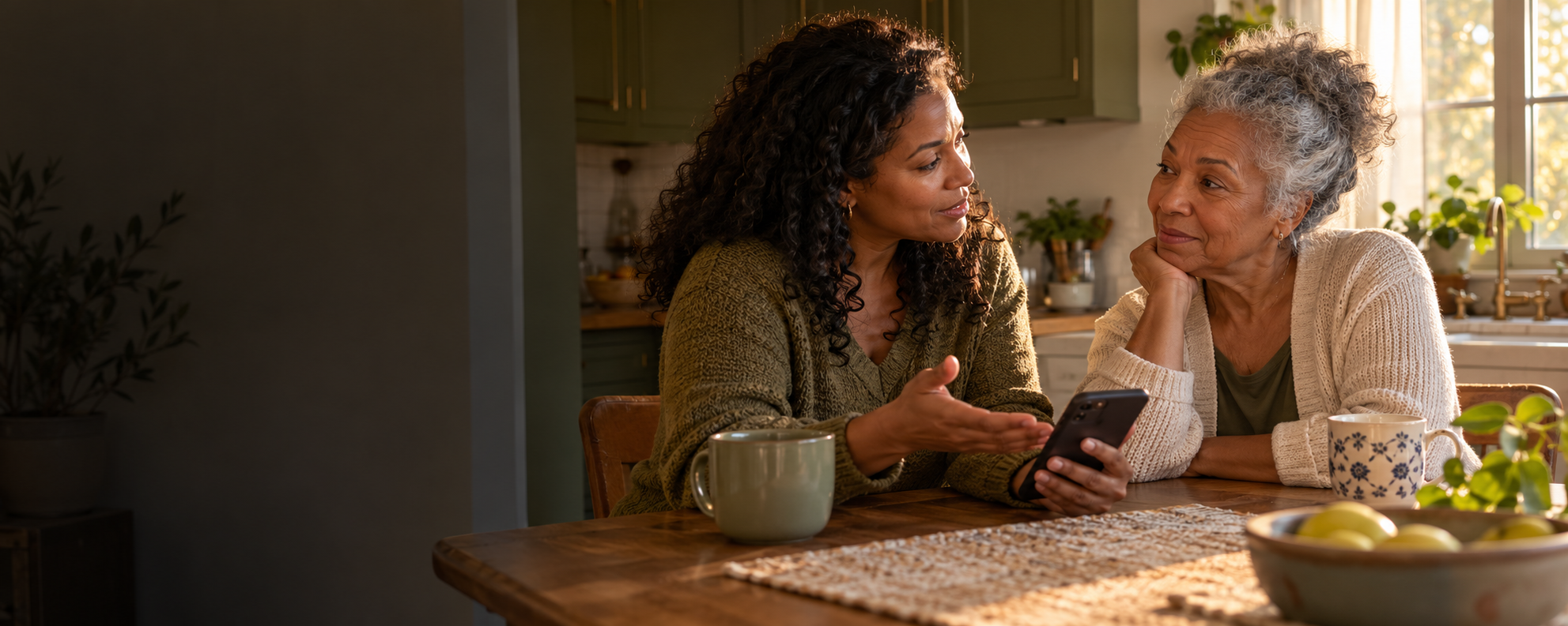 An adult daughter and her mother talking together at home